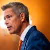 Profile of Sean Duffy against an orange background.